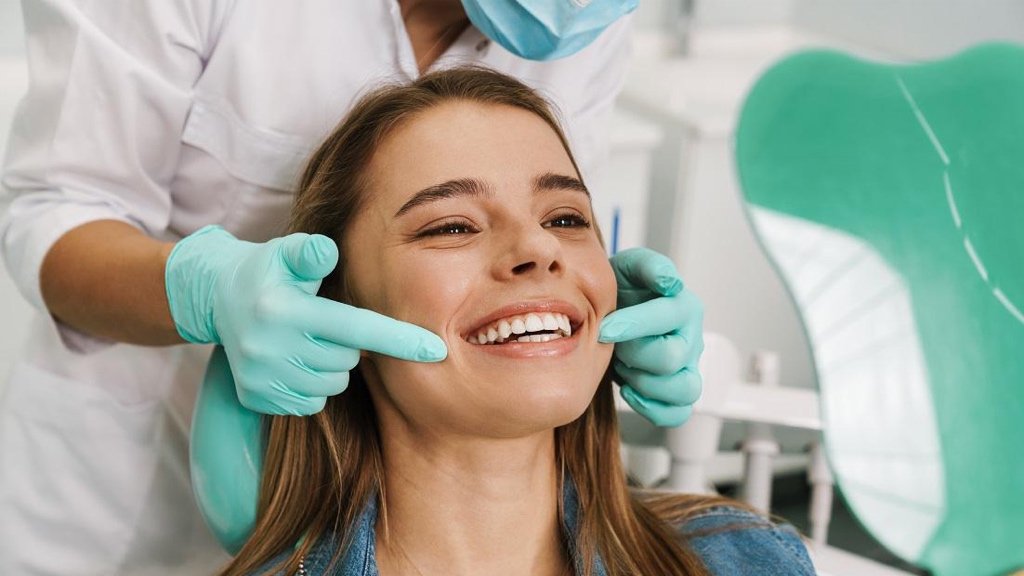 Smiling person experiencing confidence with natural dental care