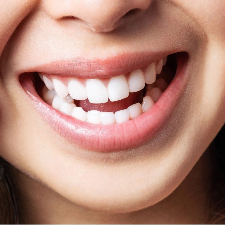Discovering the Benefits of Natural Dental Care A thoughtful individual reviewing dental care options with a hopeful expression