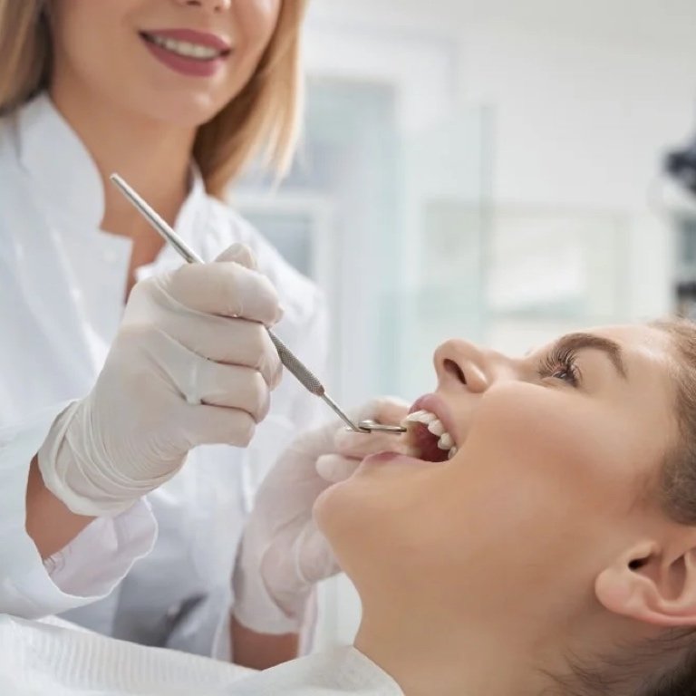Adopting Science-Based Dental Care A thoughtful woman reviewing dental care research materials